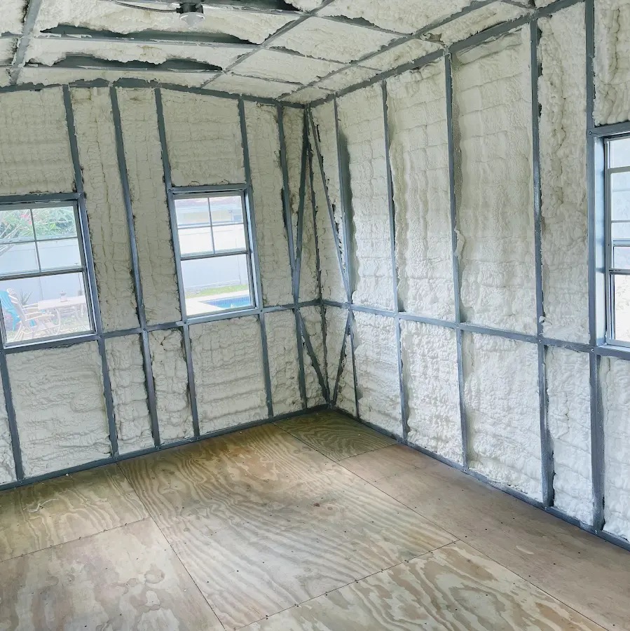 Closed-cell spray foam insulation applied to wall cavities in a residential project in Clayton
